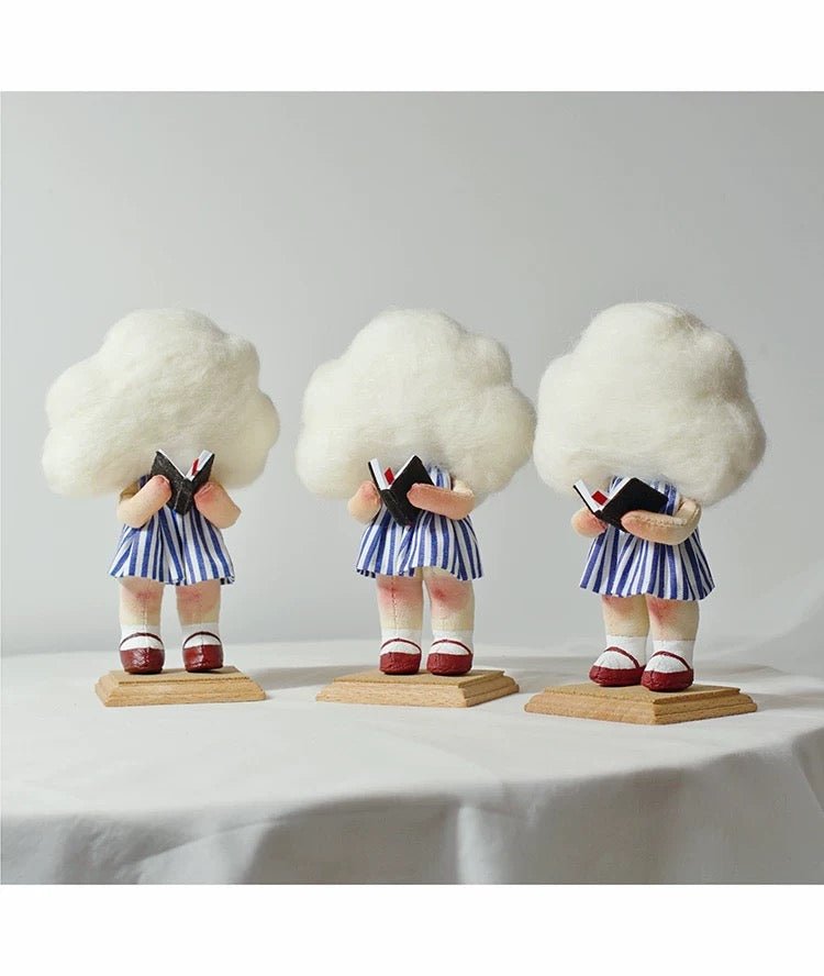 Luminous Cloud Reader Sewing Kit - Finished Craft Displayed on Bookshelf